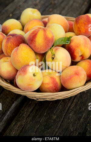 Close-up of peaches in basket Stock Photo