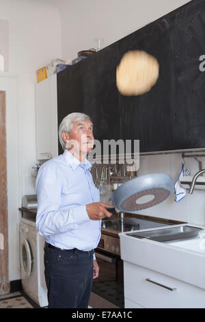 Pancake On Frying Pan In Sunlight. Making Breakfast For Kids Stock 