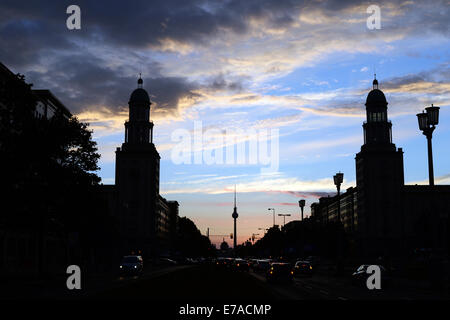 Berlin, Germany. 02nd Sep, 2014. The sun sets behind the Frankfurt Gate (Frankfurter Tor) in Berlin, Germany, 02 September 2014. Photo: JENS KALAENE/dpa/Alamy Live News Stock Photo