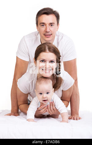 Closeup of young family with baby boy against white background Stock Photo