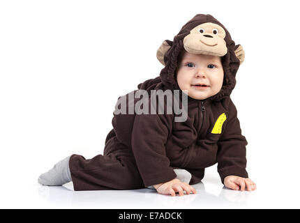 Baby boy dressed in monkey costume over white background Stock Photo