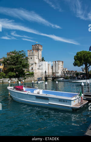 The Scaliger Castle dominates the entrance to Sirmione at the tip of the Sirmio peninsula at the Southern end of Lake Garda Stock Photo