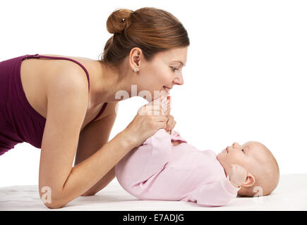 Young beautiful mother and newborn baby boy over white Stock Photo