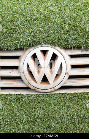 Eco transporter van covered in Astro turf and with wooden Volkswagen Badge and grill Stock Photo