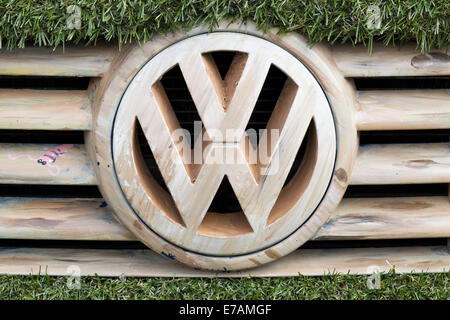 Eco transporter van covered in Astro turf and with wooden Volkswagen Badge and grill Stock Photo