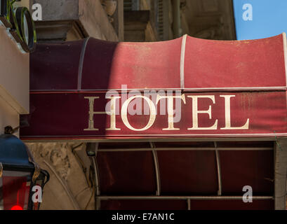A hotel sign on a red canopy in Paris France. Stock Photo