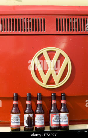 1971 Red White VW Split Screen Volkswagen camper van with empty Budweiser Beer Bottles on the bumper Stock Photo