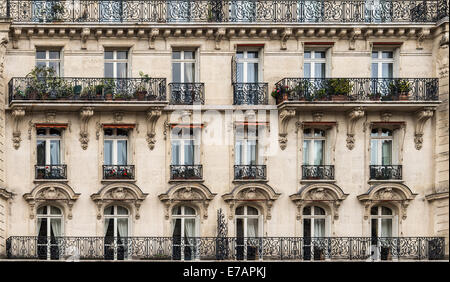 Windows and wrought iron balconies of a French classic facade Stock ...