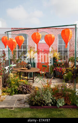 Suspended orange inflatable objects in Harrogate, Yorkshire, UK. 1 Sept, 2014.  The Harrogate Annual Autumn Flower Show, Yorkshire Showground, ranked as one of Britain's top three gardening events.  New for 2014 is Inspiration Street, a series of small courtyard gardens set against the backdrop of a traditional street scene. The Avenue will offer beautiful, larger-scale gardens, plus a new Community Spirit feature with ‘message in a garden’ designs from community groups and charities. Stock Photo