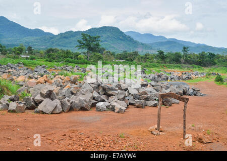 Stones to be crushed on the peninsular road near Freetown, Sierra Leone Stock Photo