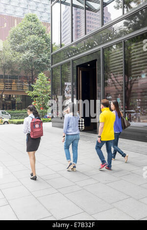 Pedestrians walk past the abercrombie and fitch store on orchard road in Singapore Stock Photo