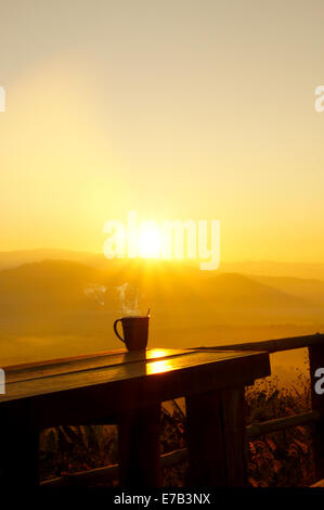 Silhouettes on sunrise morning coffee. Stock Photo