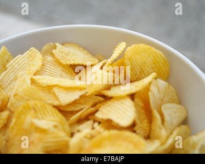 Potato crisps in a bowl Stock Photo