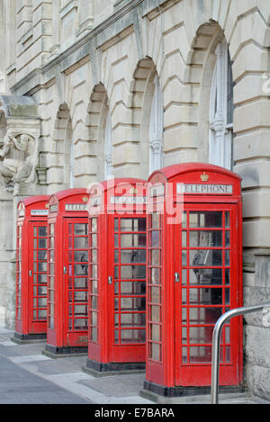 A row of 4 old style BT telephone boxes (in Blackpool, Lancashire) Stock Photo