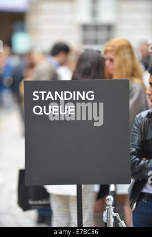 Somerset House, London, UK.12th September 2014. Queuing for the 11 O'Clock show in the courtyard of Somerset House at the start of London Fashion Week. Credit:  Matthew Chattle/Alamy Live News Stock Photo