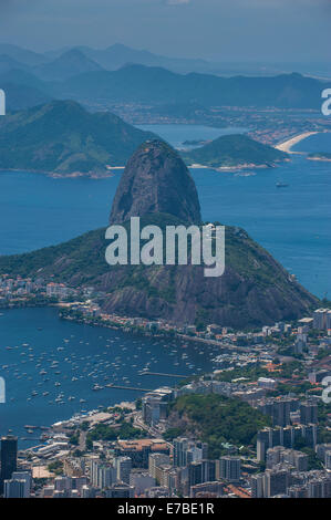 The Christ the Redeemer statue and Sugar Loaf mountain stand during ...