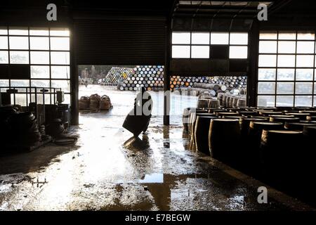 Coopers work on whisky casks at the Speyside Cooperage in Craigellachie, Scotland. Stock Photo