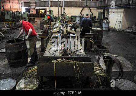 Coopers work on whisky casks at the Speyside Cooperage in Craigellachie, Scotland. Stock Photo