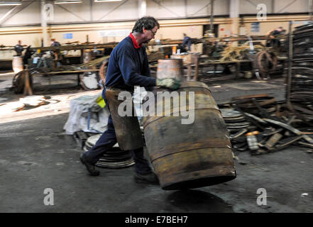 Coopers work on whisky casks at the Speyside Cooperage in Craigellachie, Scotland. Stock Photo