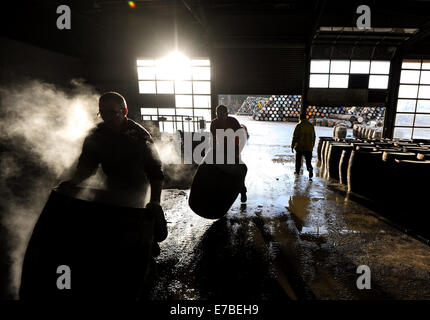 Coopers work on whisky casks at the Speyside Cooperage in Craigellachie, Scotland. Stock Photo