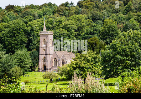 St Audries or Ethelred's church at the head of the Quantock Hills in Somerset is backed by mature woodland Stock Photo