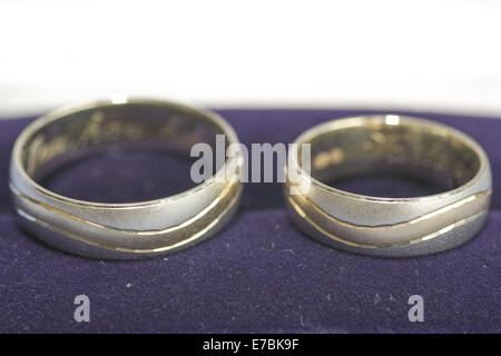 Two golden weeding rings in closeup views. Stock Photo