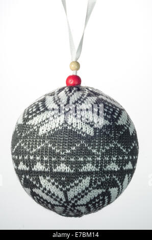 A gray and white knit Christmas ornament isolated on white Stock Photo
