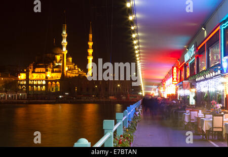 People have fun at cafes restaurant on Galata Bridge. Galata Bridge is one famous entertainment place Istanbul. Stock Photo