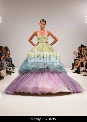 London, UK. 12 September 2014. A model walks the runway at the Ong-Oaj Pairam show at London Fashion Week SS15 at Fashion Scout/Freemasons' Hall in London, England. Photo: CatwalkFashion/Alamy Live News Stock Photo