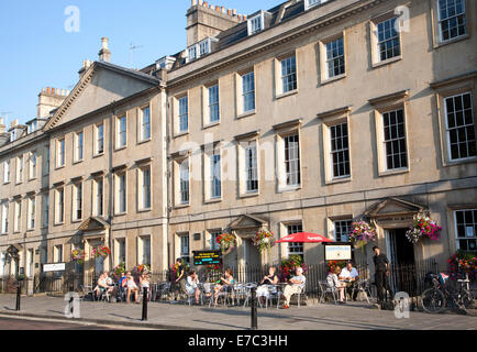 People sitting outside cafes on Georgian street of North Parade, Bath, Somerset, England Stock Photo