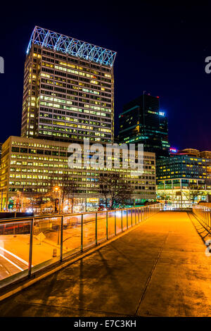 Elevated walkway and modern skyscrapers at night in Baltimore, Maryland. Stock Photo