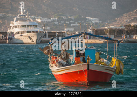 Modern Greek fishing boat moored in the harbour of the beautiful coastal  town of Sami, with a spectacular backdrop of mountains, blue sky & sea  Stock Photo - Alamy