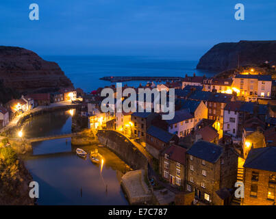 Staithes, North Yorkshire, UK. Pre sunrise view over Staithes fishing village Stock Photo