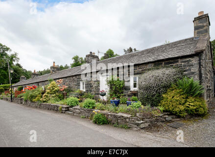 Traditional old terraced cottages with cottage gardens in historic hamlet. Port-na-Craig, Pitlochry, Perth and Kinross, Scotland Stock Photo