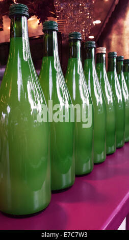 Harvest Festival. Row of New Wine in Green Bottles for Sale Stock Photo
