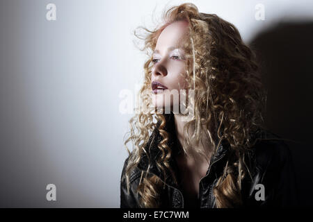 Portrait of Young Woman with Frizzy Hair Stock Photo