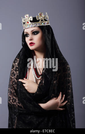 Witchcraft. Woman in Old-Fashioned Clothes and Crown Stock Photo