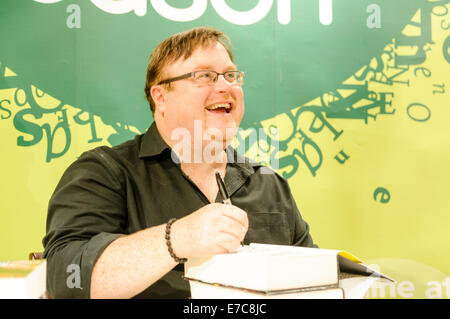 Belfast, Northern Ireland. 13 Sep 2014 - Irish fantasy author Derek Landy signs books for fans Credit:  Stephen Barnes/Alamy Live News Stock Photo