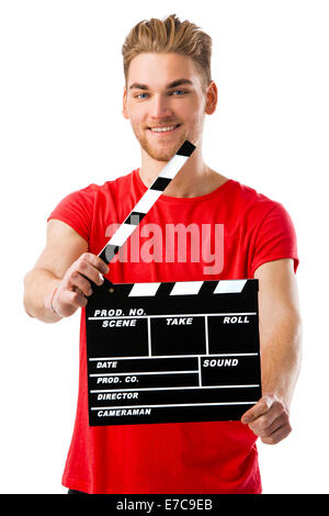 Casual young man holding a clapboard, over a white background Stock Photo
