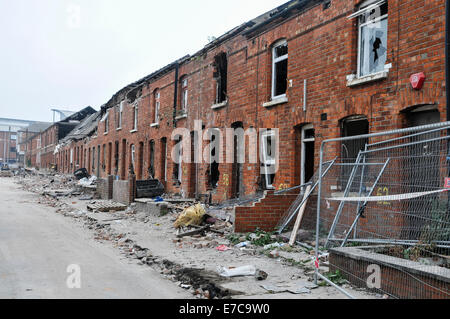 Derelict terraced houses ready to be demolished to make way for new homes Stock Photo