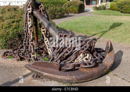 Large rusty ship's anchor and anchor rode chain on display in the Fernandina Harbor Marina, Florida, USA. Stock Photo
