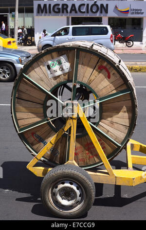 Cable reel on a trailer on Amazonas Avenue on August 4, 2014 in Quito, Ecuador Stock Photo