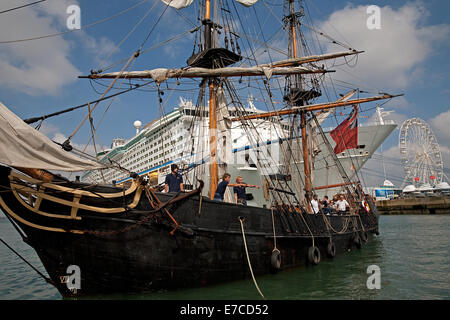 Tall ship Phoenix docks in front of the Adventure of the Seas cruise ship at the Southampton boat show 2014 Stock Photo