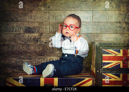 UK Great Britain style, little Englishman in bow-tie and suspenders, with glasses Stock Photo