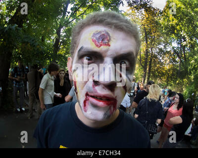 Kiev, Ukraine. 13th September, 2014. People dressed as a zombie parades on a street during a zombie walk -- In Kiev passed the crowd of walking dead. One of the main requirements of the parade was, 'Let's eat brains, but reserve the mud!' Credit:  Igor Golovnov/Alamy Live News Stock Photo