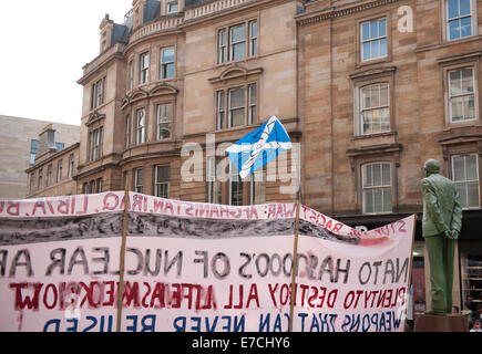 Glasgow, Scotland, UK. 13th September, 2014. The Donald Dewar statue stands tall next to Nato protesters during the lead up to the Scottish independence referendum on Buchanan Street, Glasgow, Scotland on Saturday 13th September 2014 Credit:  Iona Shepherd/Alamy Live News Stock Photo