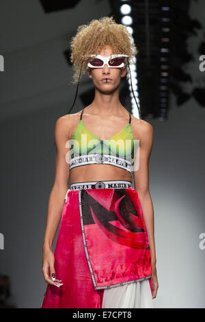 London, UK. 13 September 2014. A model walks the runway at the Nasir Mazhar show at London Fashion Week SS15 at the BFC Courtyard Show Space in London, England. Photo: CatwalkFashion/Alamy Live News Stock Photo