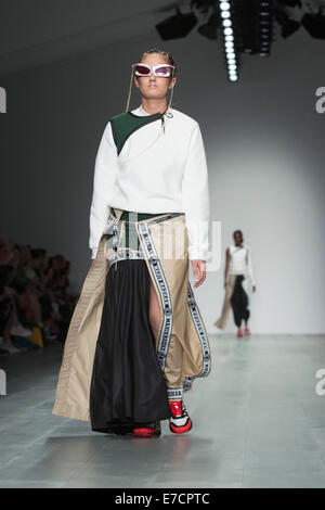 London, UK. 13 September 2014. A model walks the runway at the Nasir Mazhar show at London Fashion Week SS15 at the BFC Courtyard Show Space in London, England. Photo: CatwalkFashion/Alamy Live News Stock Photo