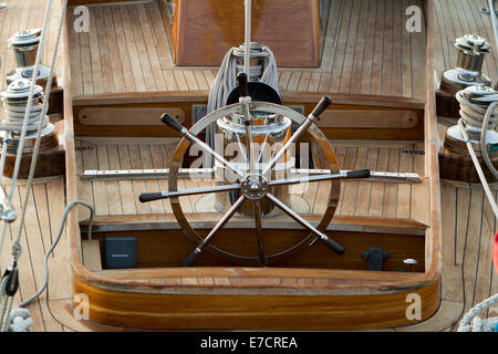 Imperia, Italy. 14th September 2014. The helm wheel of a vintage yacht participating in Vele d'Epoca classic yachts regatta. Stock Photo