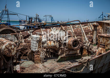 old and rusty desolate fishing ship in shipyard Stock Photo